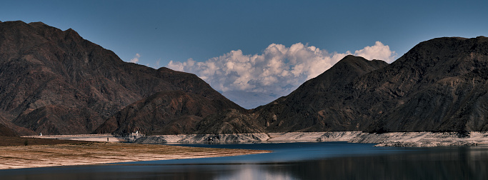 View of mountain lake (Orto-Tokoy reservoir) on sunny autumn day