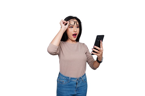 Excited Young Asian Woman with Phone