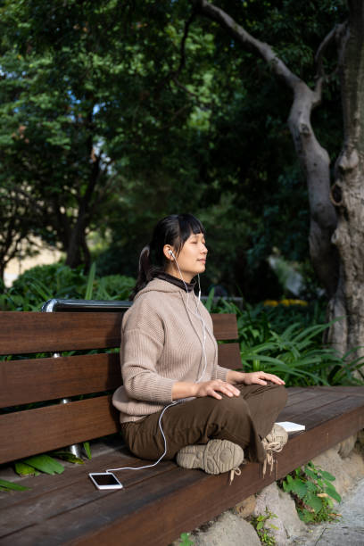 istock A woman is resting on a park bench 1709874154