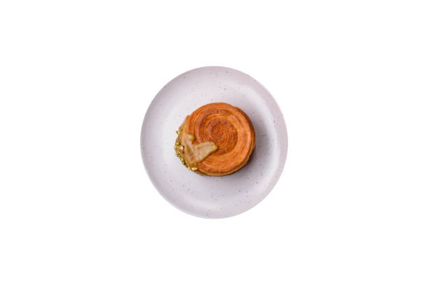 istock Round puff pastry croissant with raspberry filling or new york roll 1709876819