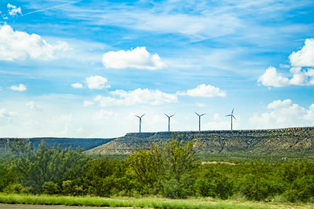 istock Four windmills on a lone plateau in texas 1709878331