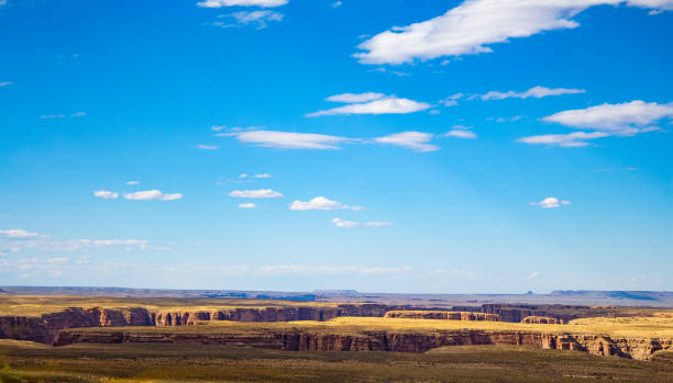 istock Blue skies with sparse clouds at the top of deep canyons 1709878758