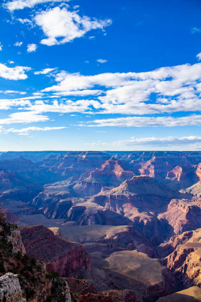 istock Grand canyon with bright blue sky and white clouds 1709878931