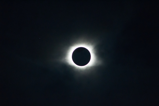 Lone star with solar corona during eclipse