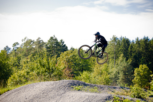action jumping style on the mountain bike track.