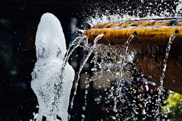 istock In the fountain, the fluid flows under high pressure and bubbles form 1709916746