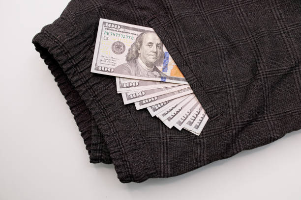 istock Dollar bills sticking out of your pocket. 1709918717