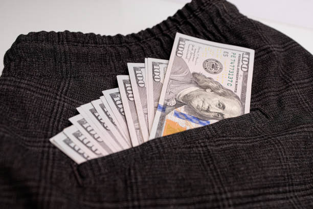istock Dollar bills sticking out of your pocket. 1709918739