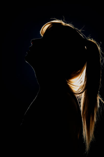 istock Silhouette of woman's head with ponytail 1709965361