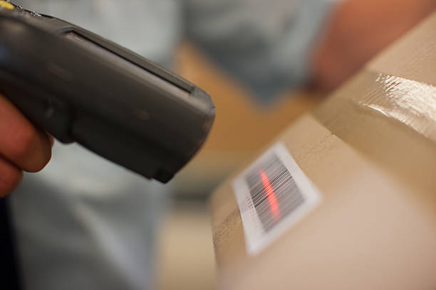 Close up of worker scanning box  barcode reader stock pictures, royalty-free photos & images