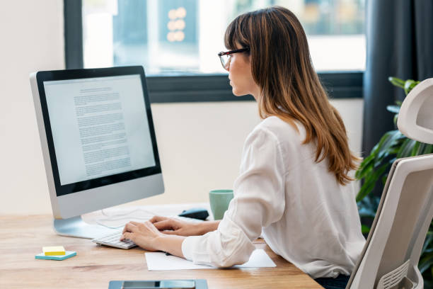 istock Creative young business woman working with computer in a modern startup 1709994620