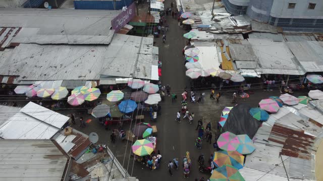 Low aerial flyover: Galeria Central street market in San Salvador