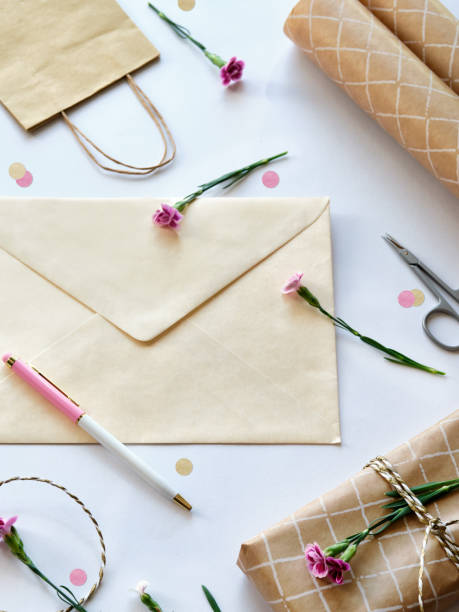 istock Envelope and self made greeting card concept with fresh carnation flowers. 1710078765