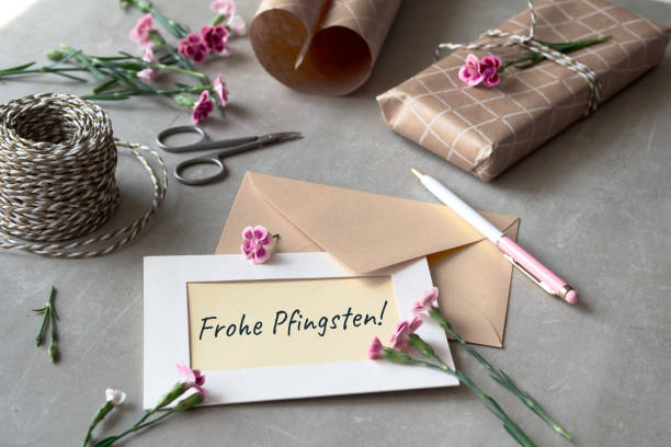 istock Envelope and self made greeting card concept with fresh carnation flowers. 1710078776