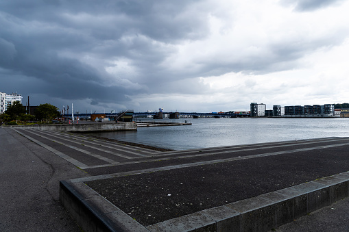 Cloudy weather in the city. Waterfront of the Danish city of Aalborg, Denmark - Oktober 01, 2023.