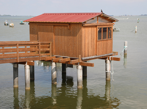 small wooden house used by fisherman in summer