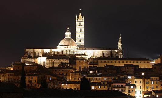 Night view of illuminated Siena Cathedral in Central Italy