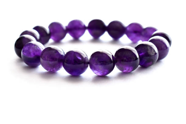 istock Amethyst gemstone bracelet on the table. 1710139435