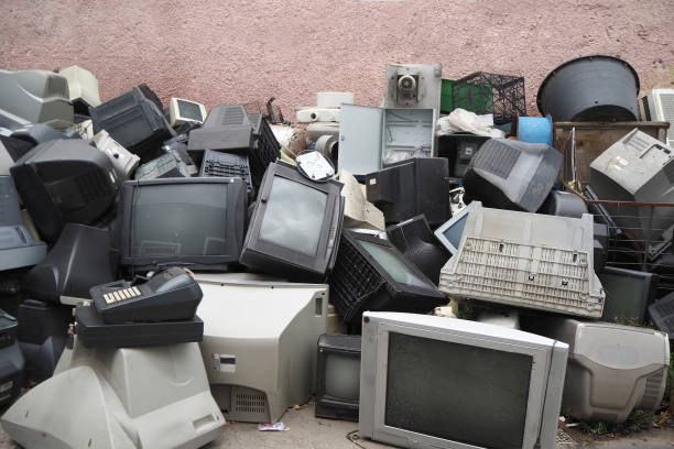 Electronic and plastic scrap Electronic waste. Out of use monitors and televisions. Recycling industry. Mixed-plastic waste in electronics. crt computer screen stock pictures, royalty-free photos & images