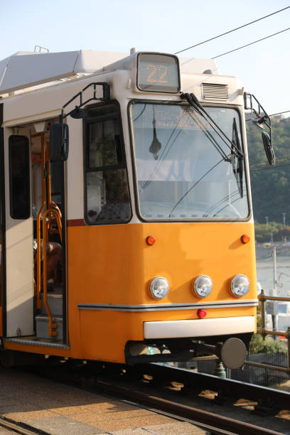 istock Old yellow tram stopped at terminal without people 1710160750