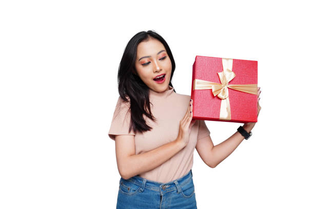 istock Young Happy Asian Woman Holding Gift 1710194203