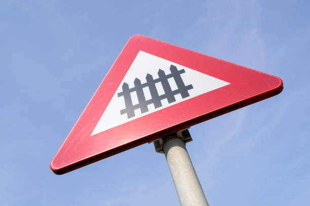 Dutch road sign: level crossing with barrier or gates ahead