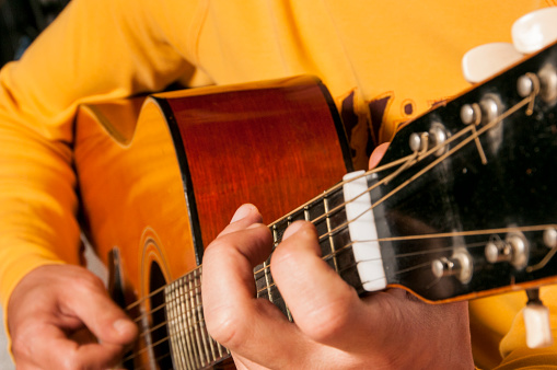 Close-Up View Of Man Playing Classical Guitar