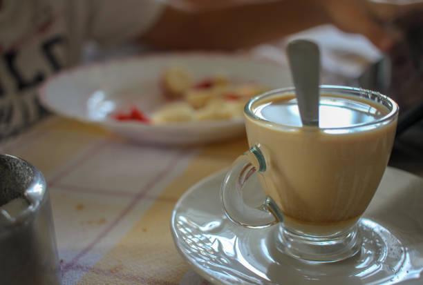 istock a coffee with milk and a plate with fruit 1710350620