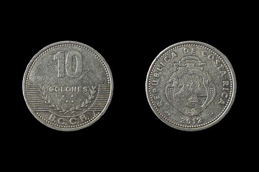 Costa Rican colon coin obverse and reverse, ten colones, on a black background