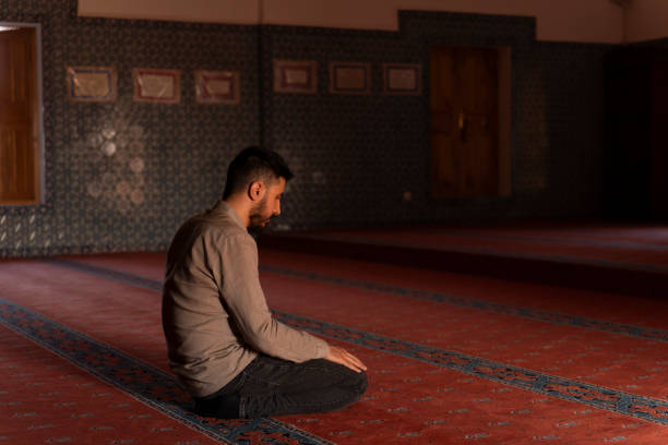 istock Muslim man worshipping in a mosque. 1710407497