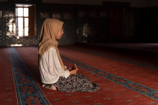 istock Girl child praying in mosque. 1710410880