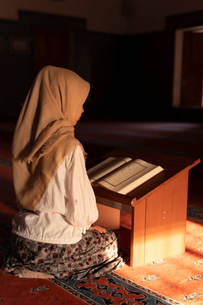 istock A girl reading the Koran in a mosque. 1710416653