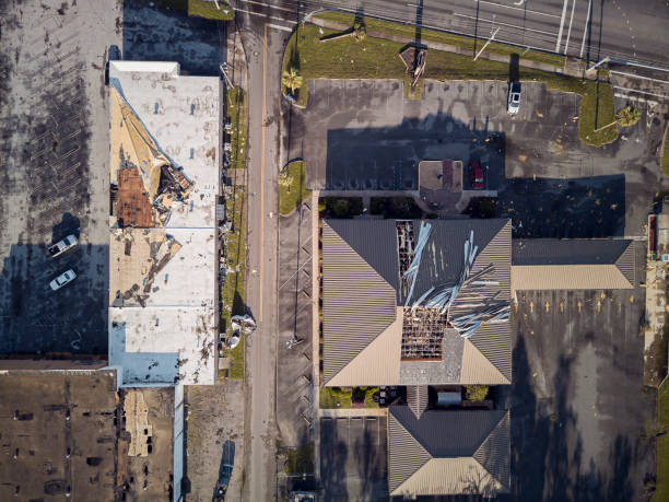 istock Roofless and wrecked shops: public building roofs torn off. Debris strewn in aftermath of hurricane disaster in Perry, North Florida. Aerial view 1710482874