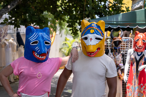 Olinda, Pernambuco, Brazil: Young couple wearing carnival masks bought in a gift shop.