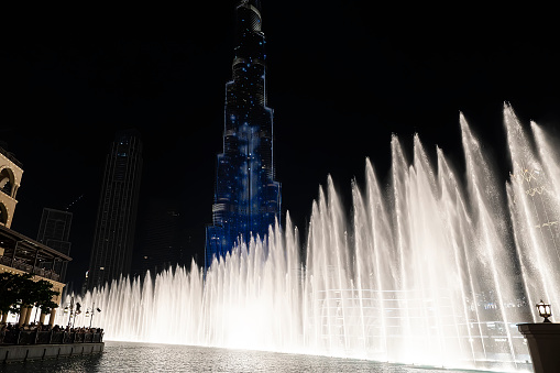 Dubai, UAE , United Arab Emirates. November 29th, 2022. Amazing fountain show in front of the Burj Khalifa skyscraper at night in Dubai.