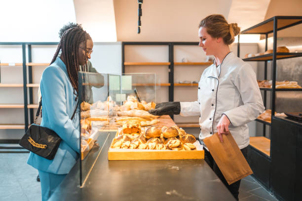 istock Diverse Customers Buying Freshly Baked Goods In An Artisanal Bakery 1710512287