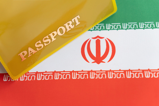 Iranian passport on background Iranian flag , Iranian passport , also known as Persian passports, are issued to nationals of Iran for the purpose of international travel.