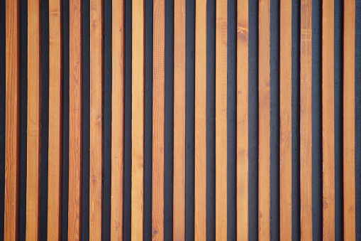 Background of brown wooden slats, texture of wood strips