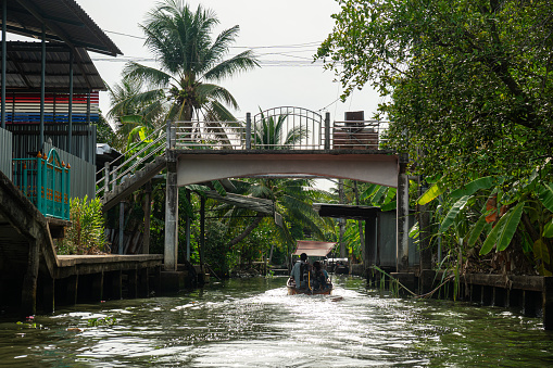 Famous floating market in Thailand, Damnoen Saduak floating market, tourists visiting by boat, Ratchaburi, Thailand.