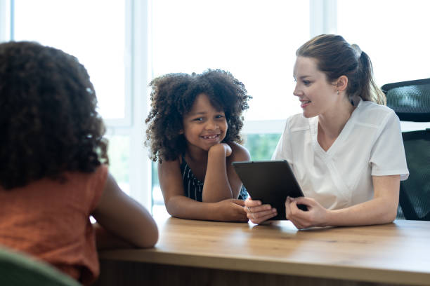 istock A young pediatric dentist with children - patients 1710521873