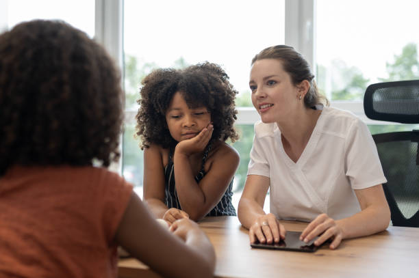 istock A young pediatric dentist with children - patients 1710521893