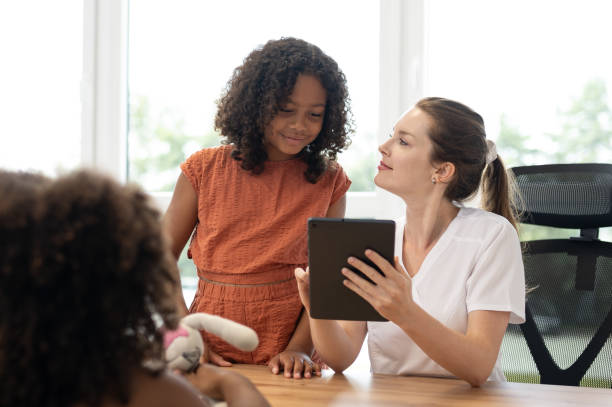 istock A young pediatric dentist with children - patients 1710521903