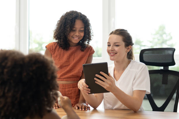 istock A young pediatric dentist with children - patients 1710521914