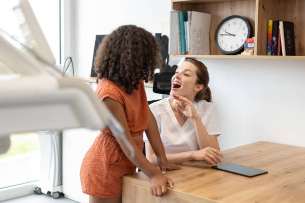 istock A young pediatric dentist with children - patients 1710521920
