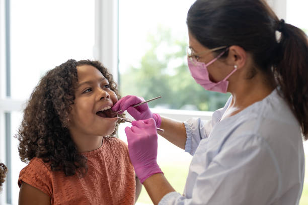 istock A young pediatric dentist with children - patients 1710521958