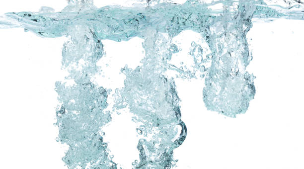 istock Drinking water pouring into clear glass. Bubbles inside from pouring falling clear water. Drinking soda water flush air bubble. White background isolated freeze element 1710522078