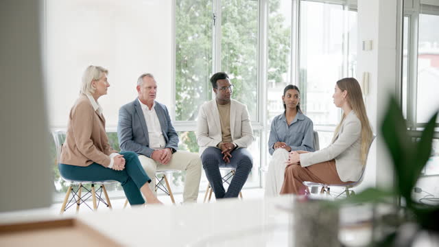 Talking, meeting and people with a support discussion, listening and learning from friends. Communication, help and a group of men and women speaking for therapy or counselling together with trust
