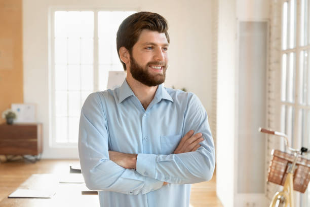 istock Pensive male employee look in distance thinking 1710527765