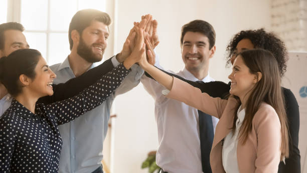 istock Overjoyed diverse coworkers give high five in office 1710527845