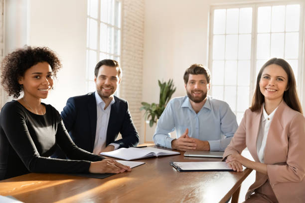 istock Portrait of smiling diverse employees posing in office 1710527866